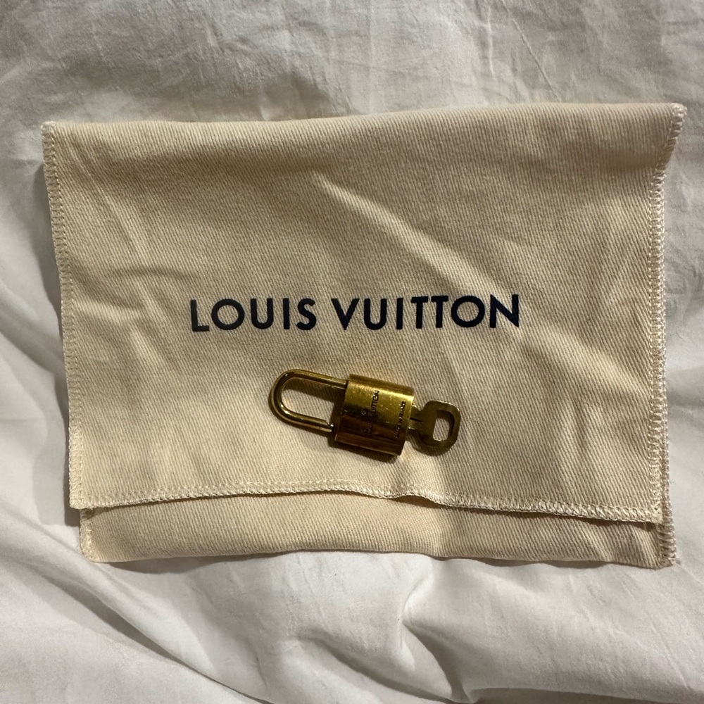 Authentic Louis Vuitton Gold Lock with Beige Pouch